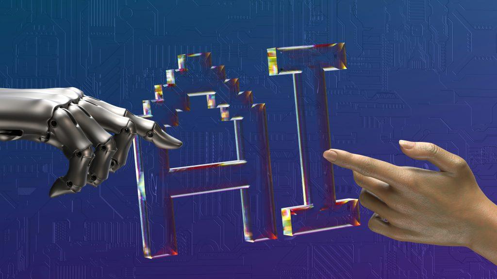 Robotic hand and human hand reaching toward the letters "AI"